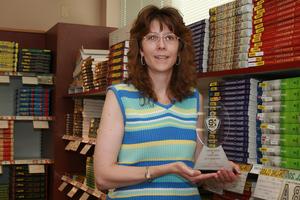 Kay Hill holding an award